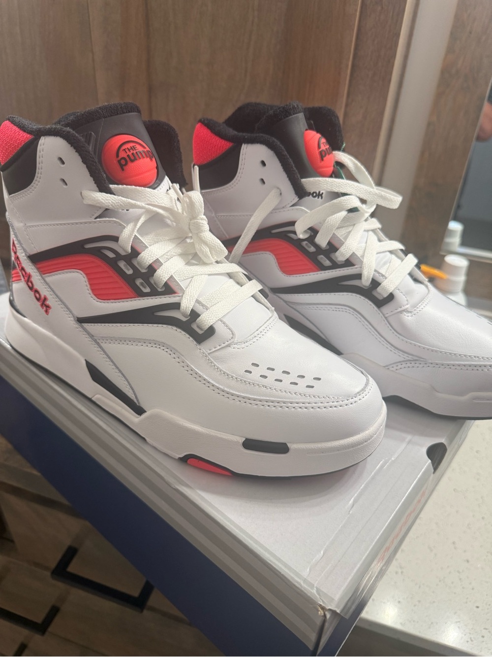Reebok White High-Top Sneakers with Red and Black Accents